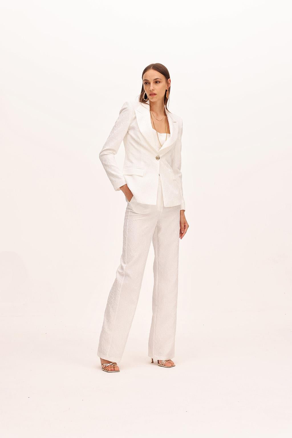 Pantalone dalla linea a palazzo in tessuto effetto stropicciato. - Monique Garçonne
