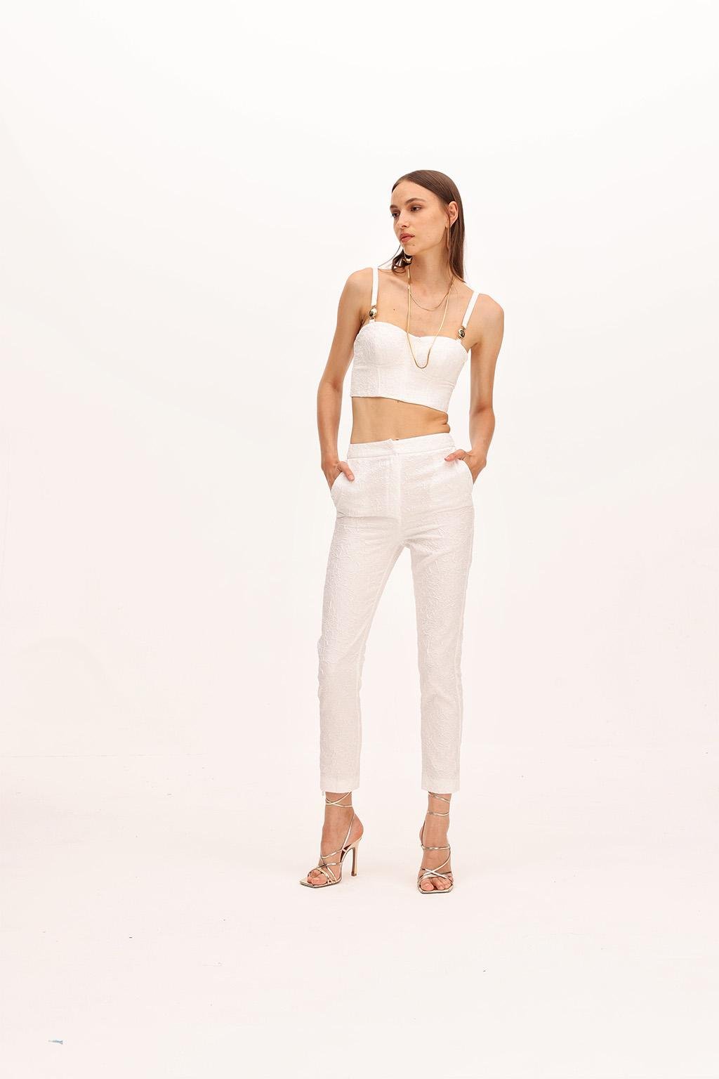 Pantalone dalla linea slim in tessuto effetto stropicciato. - Monique Garçonne