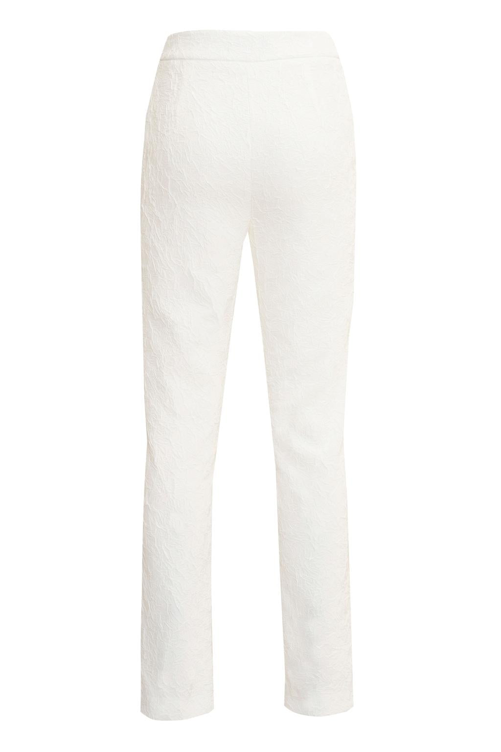 Pantalone dalla linea slim in tessuto effetto stropicciato. - Monique Garçonne
