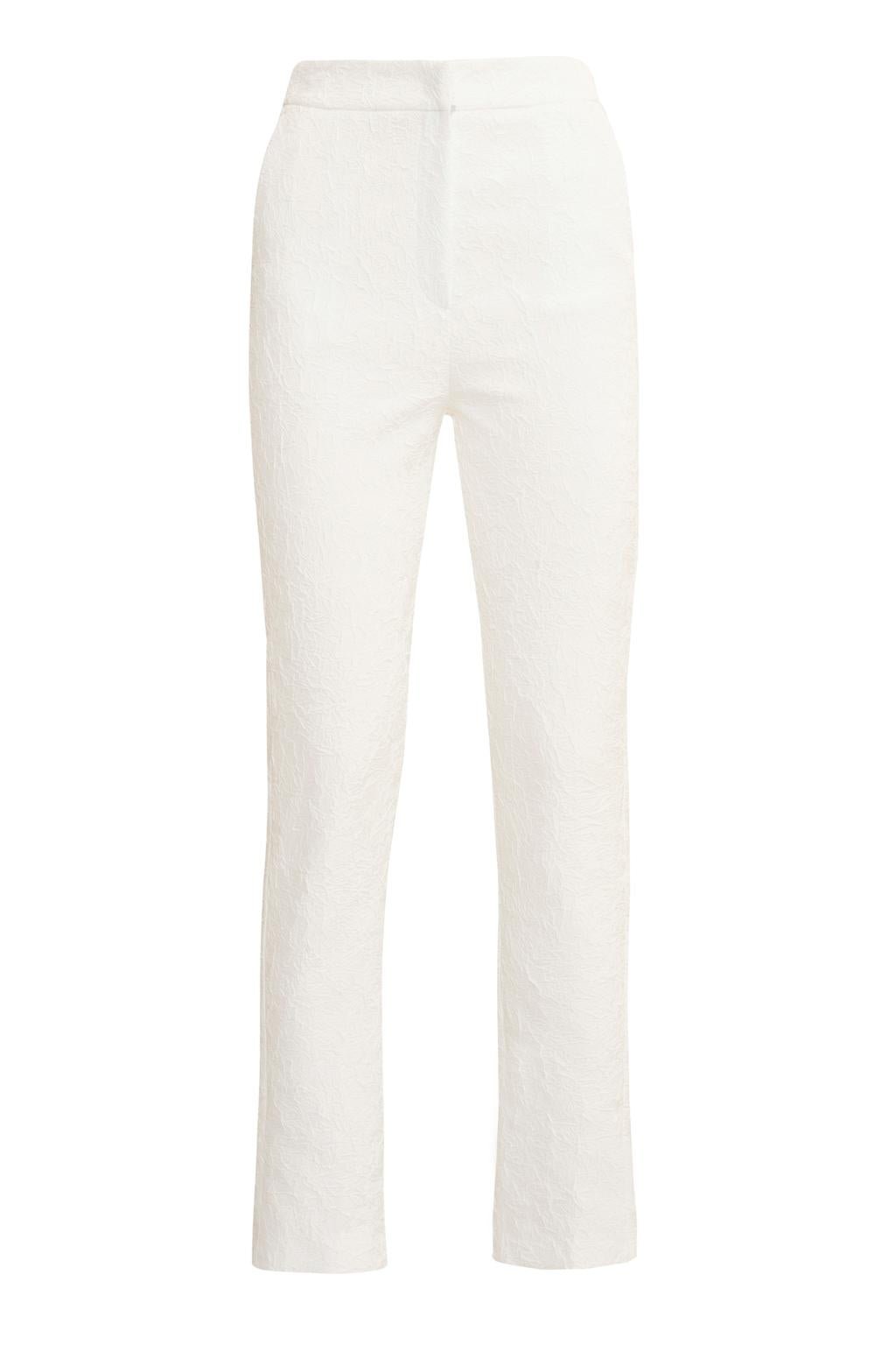 Pantalone dalla linea slim in tessuto effetto stropicciato. - Monique Garçonne